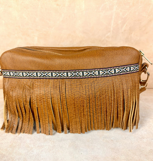 Masih Studio Arman Nomad Slim leather shoulder bag with fringe detail.