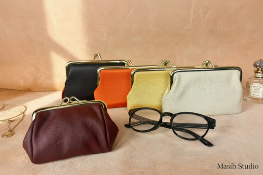 

Small coin purse with metal kiss lock frame in multiple colors