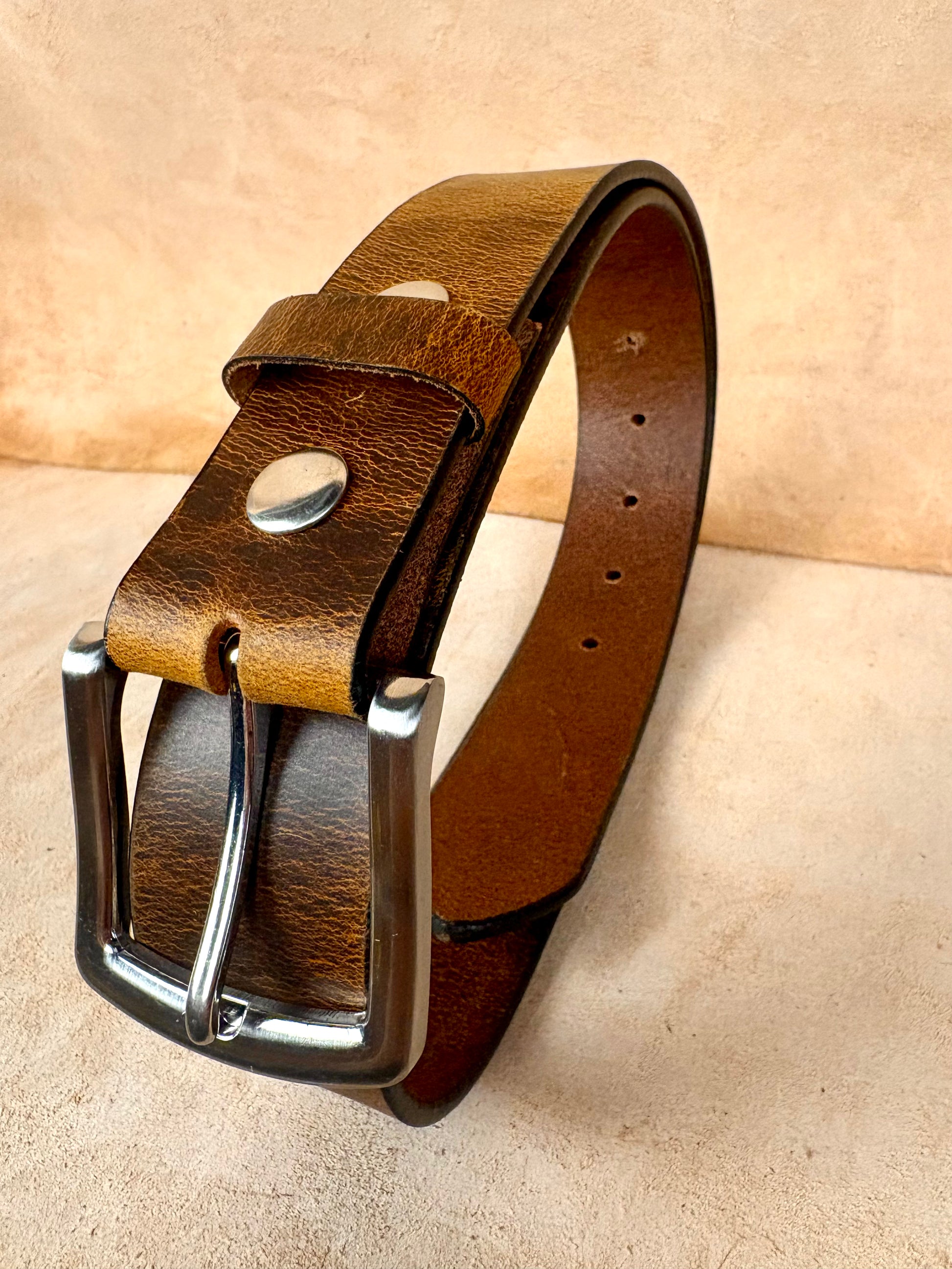 vintage brown leather belt with steel buckle