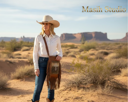 Brown leather fringe bag with hair-on hide cross design front view