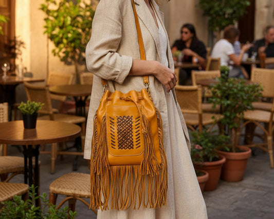 Darya fringe leather bucket bag front view