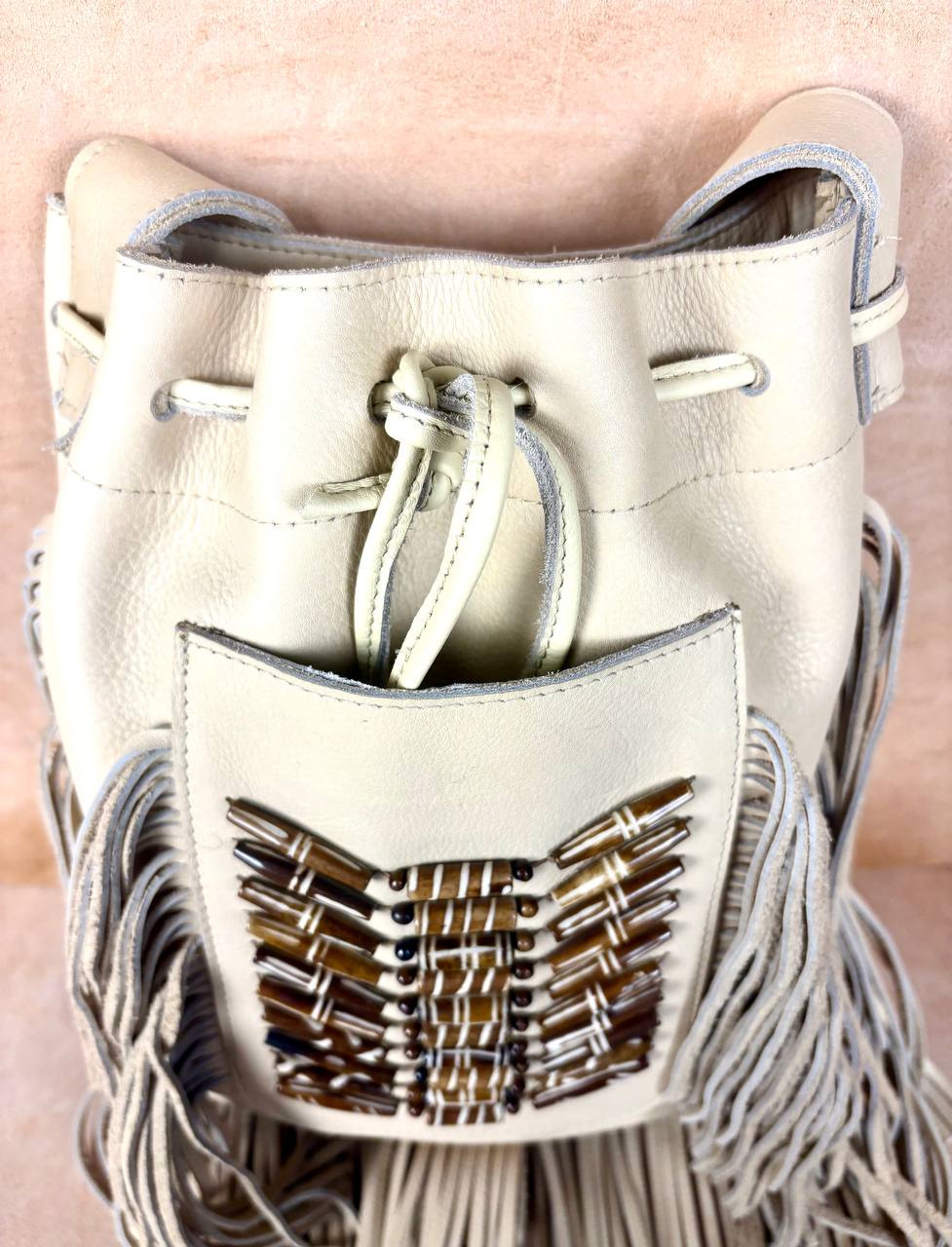 Raha leather bucket bag bead detail
