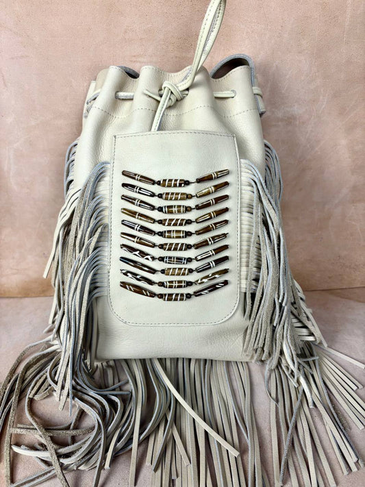 Raha leather bucket bag top view with drawstring closure